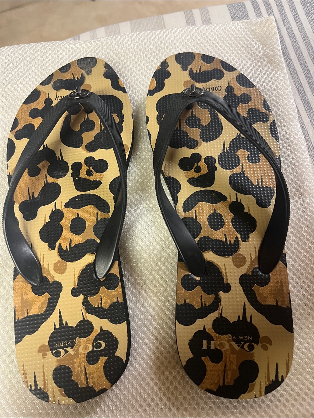Coach Leopard-Print Flip Flop Sandals in Black and Tan